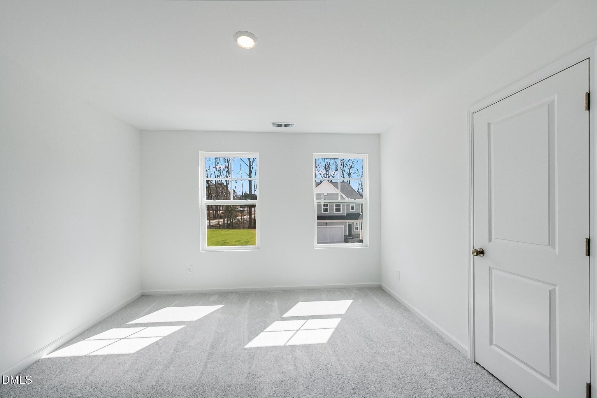 1004 Red Finch Way Angier, NC 27501 - Photo 22 of 42 an empty room with windows