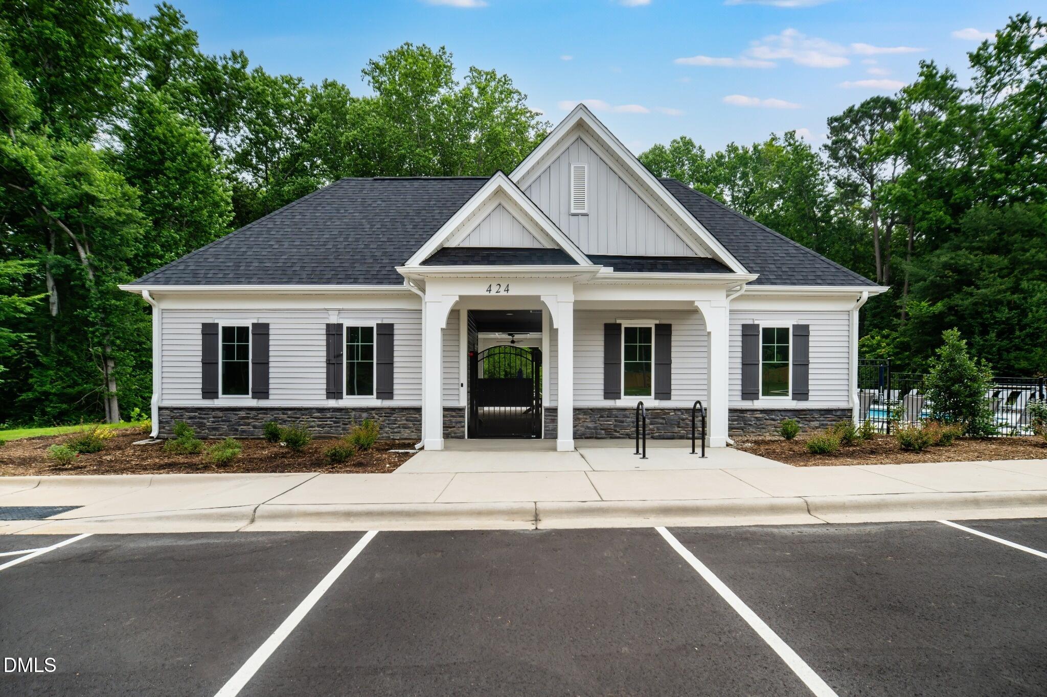 1004 Red Finch Way Angier, NC 27501 - Photo 25 of 42 a front view of a house with outdoor seating and trees