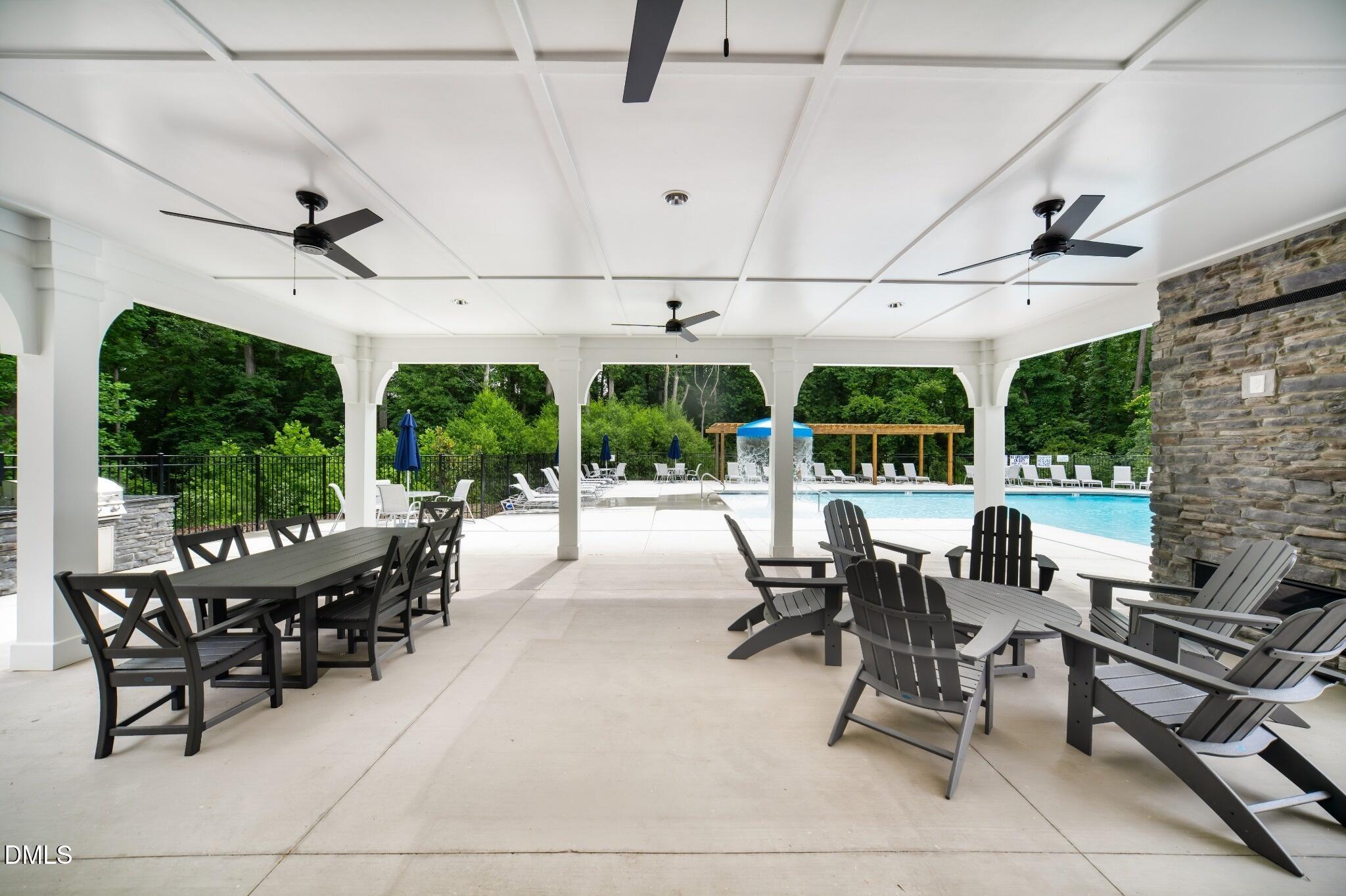 1004 Red Finch Way Angier, NC 27501 - Photo 28 of 42 a outdoor space with lots of tables a garden and chairs