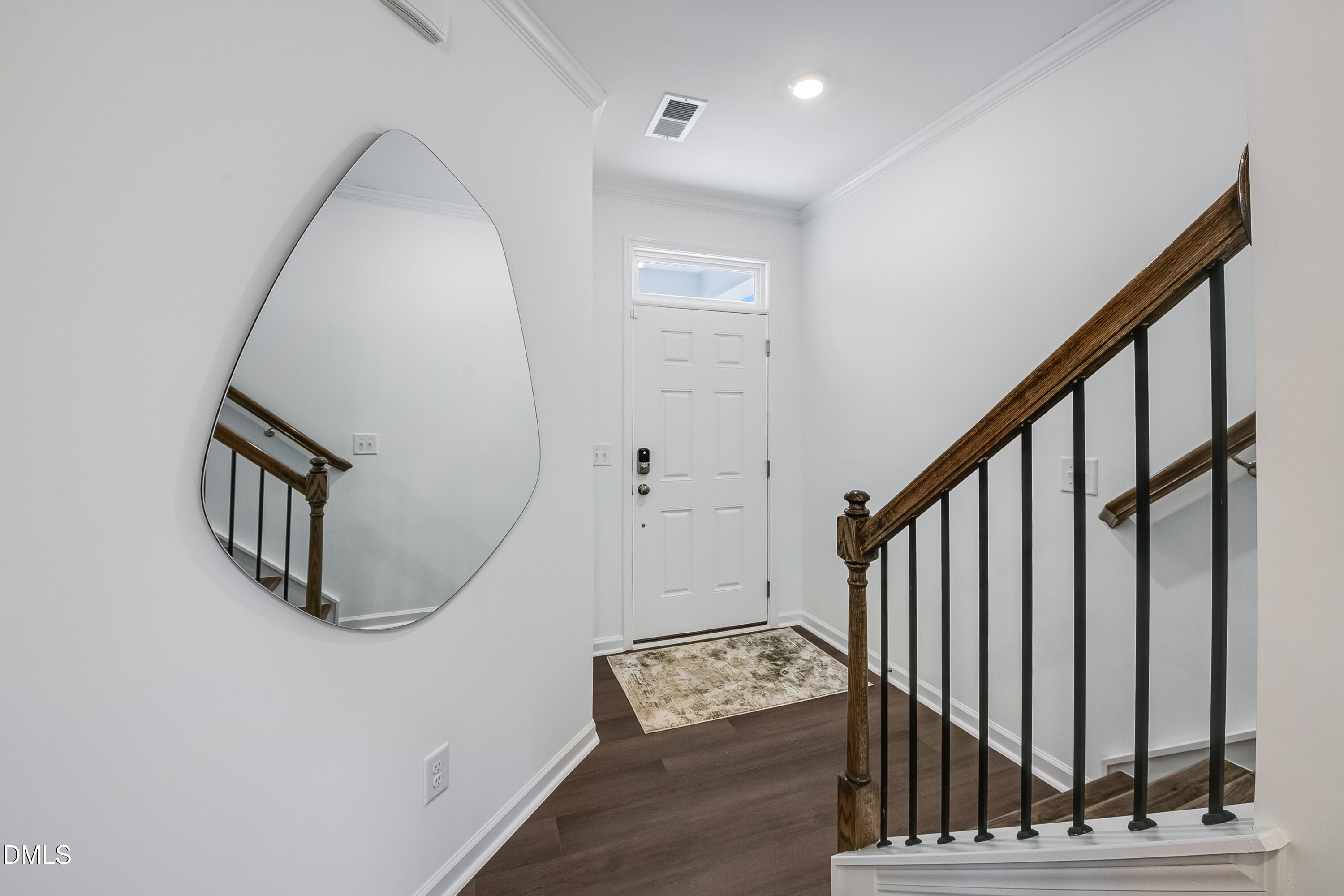 1004 Red Finch Way Angier, NC 27501 - Photo 3 of 42 a view of an entryway with wooden floor