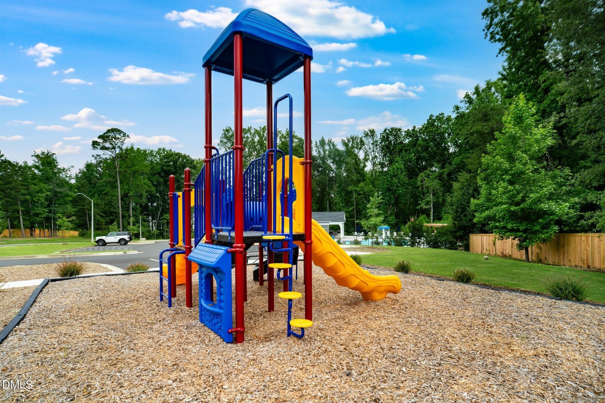 1004 Red Finch Way Angier, NC 27501 - Photo 36 of 42 a view of a park with swings and slides