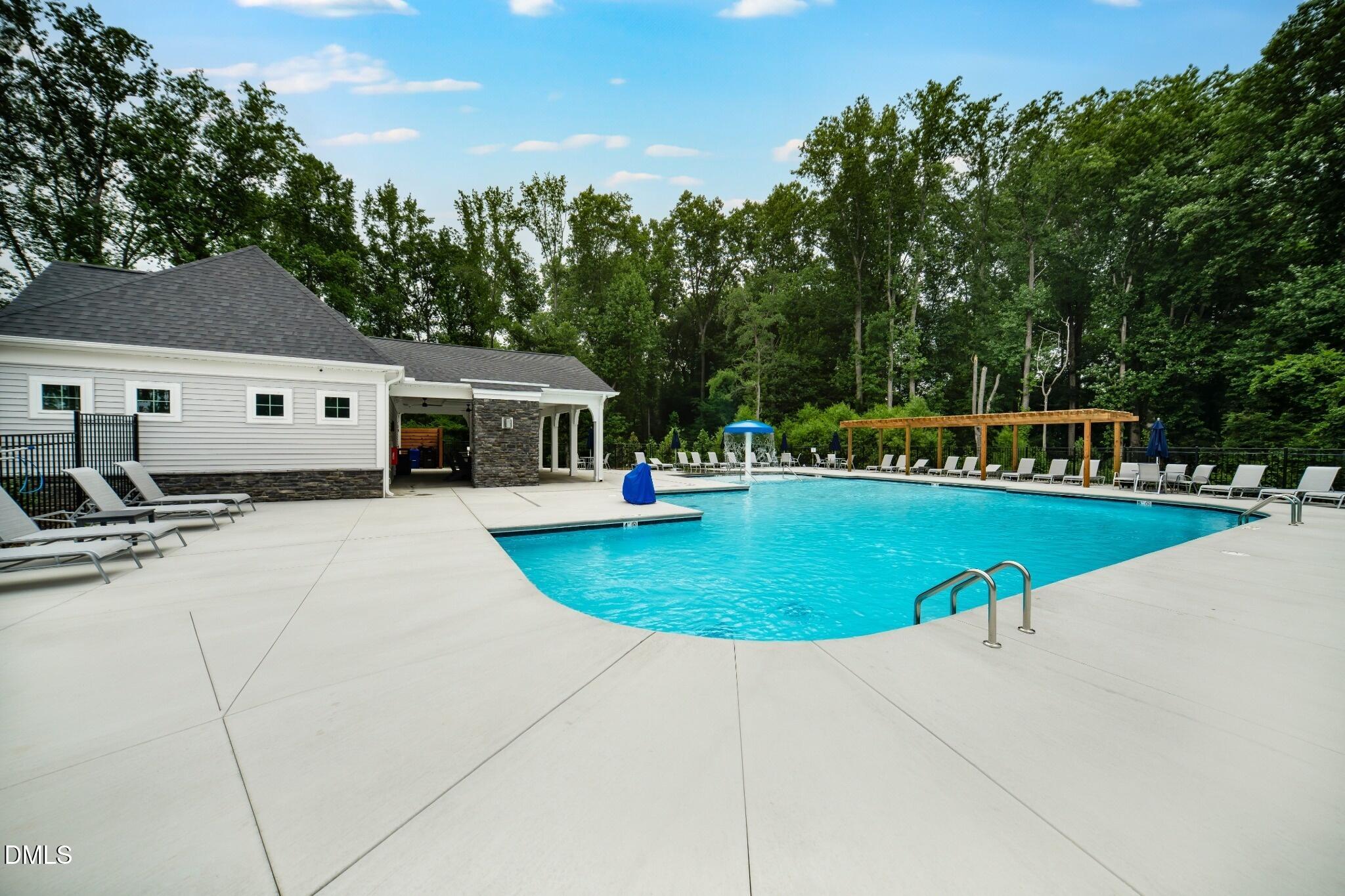 1004 Red Finch Way Angier, NC 27501 - Photo 40 of 42 a view of a house with swimming pool and yard