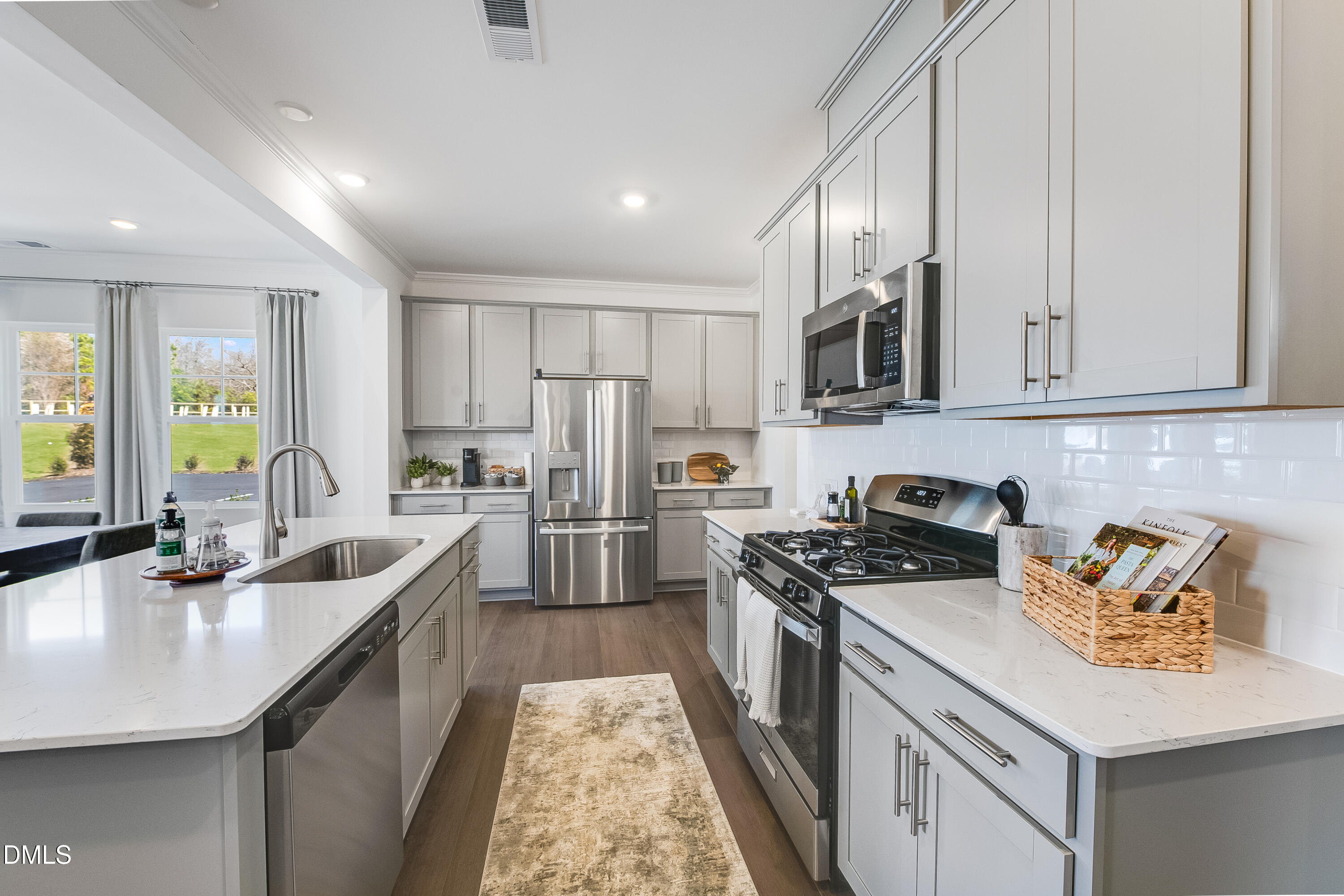 1004 Red Finch Way Angier, NC 27501 - Photo 4 of 42 a kitchen that has a sink a stove and cabinets