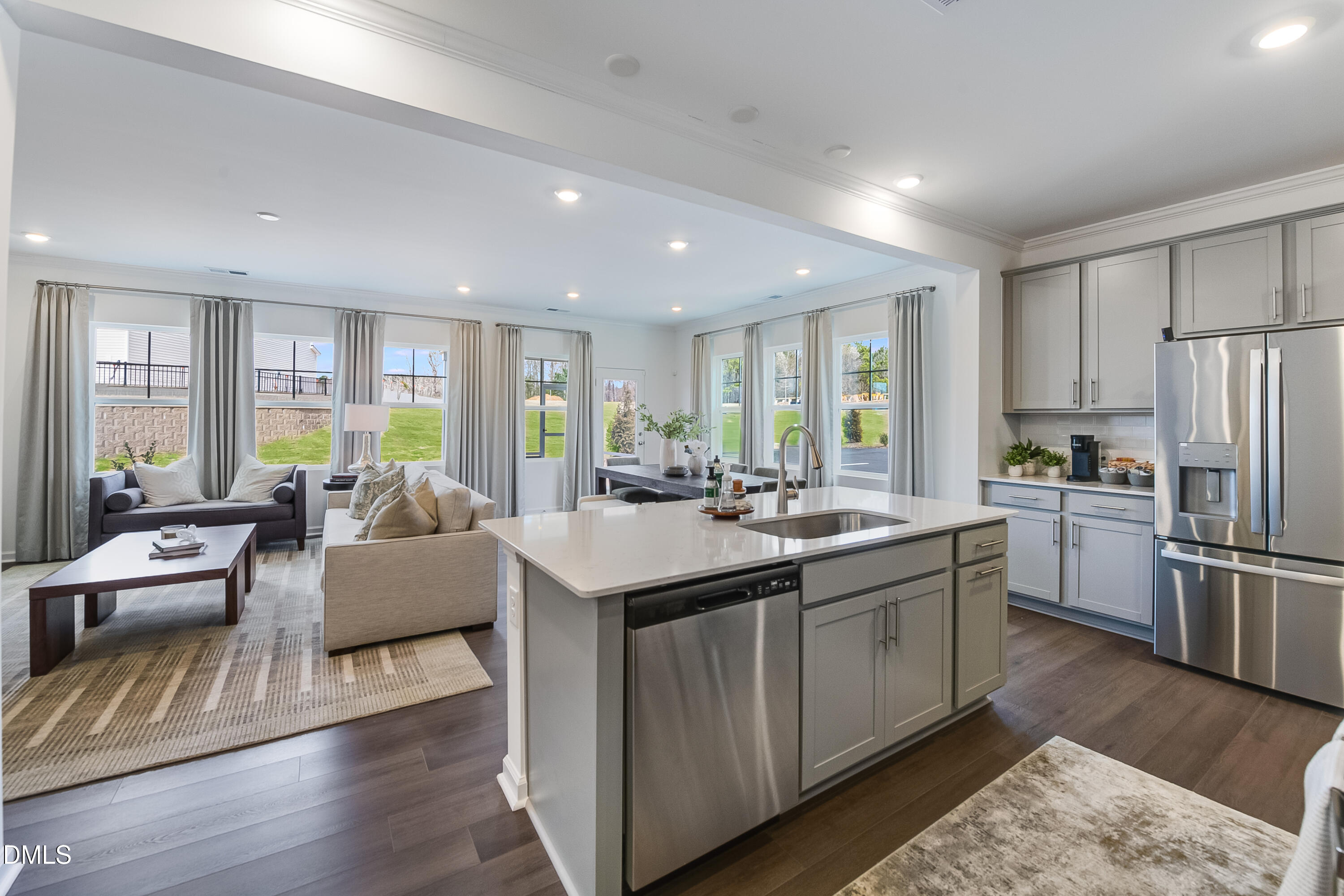 1004 Red Finch Way Angier, NC 27501 - Photo 5 of 42 a kitchen with stainless steel appliances granite countertop a sink stove and refrigerator