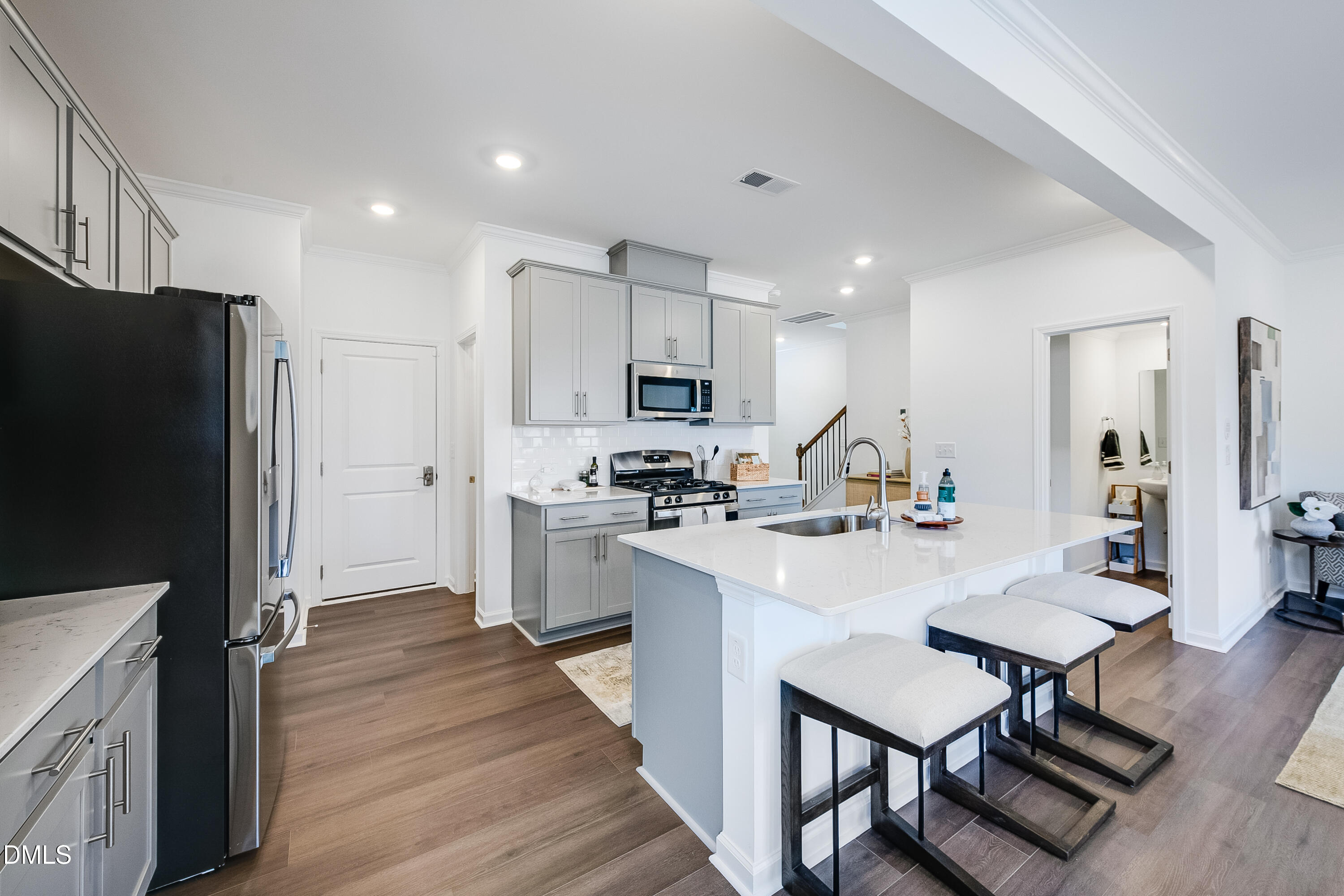 1004 Red Finch Way Angier, NC 27501 - Photo 6 of 42 a kitchen with stainless steel appliances granite countertop a refrigerator a stove top oven a sink dishwasher and a refrigerator