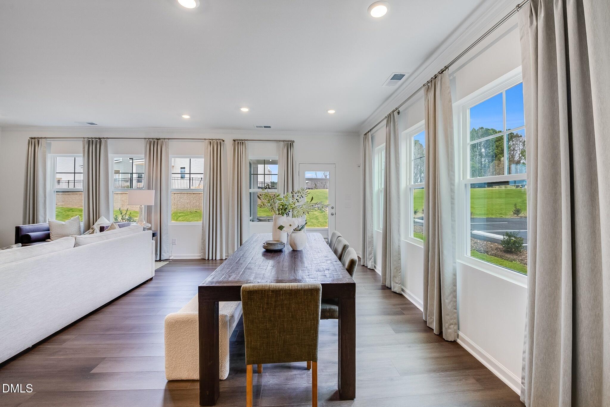 1004 Red Finch Way Angier, NC 27501 - Photo 8 of 42 a living room with furniture and a wooden floor
