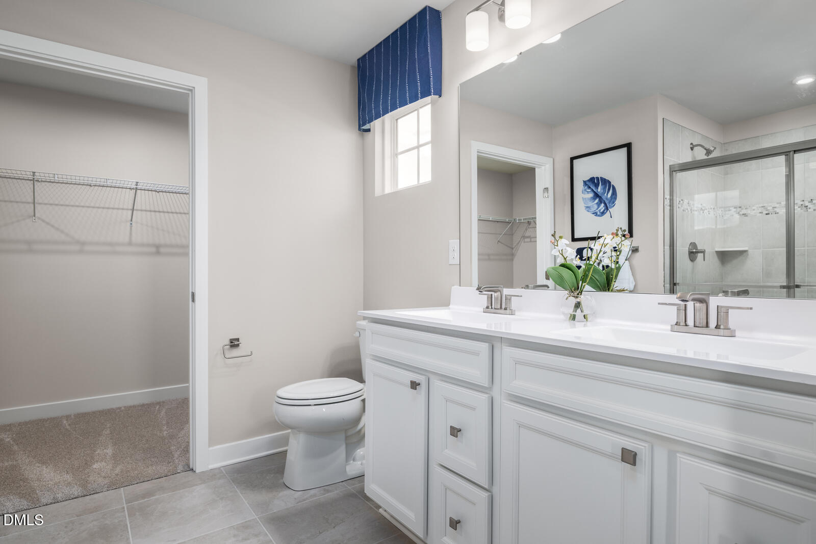 500 Country Side Way Fuquay-Varina, NC 27526 - Photo 15 of 22 a spacious bathroom with a double vanity sink toilet and a mirror