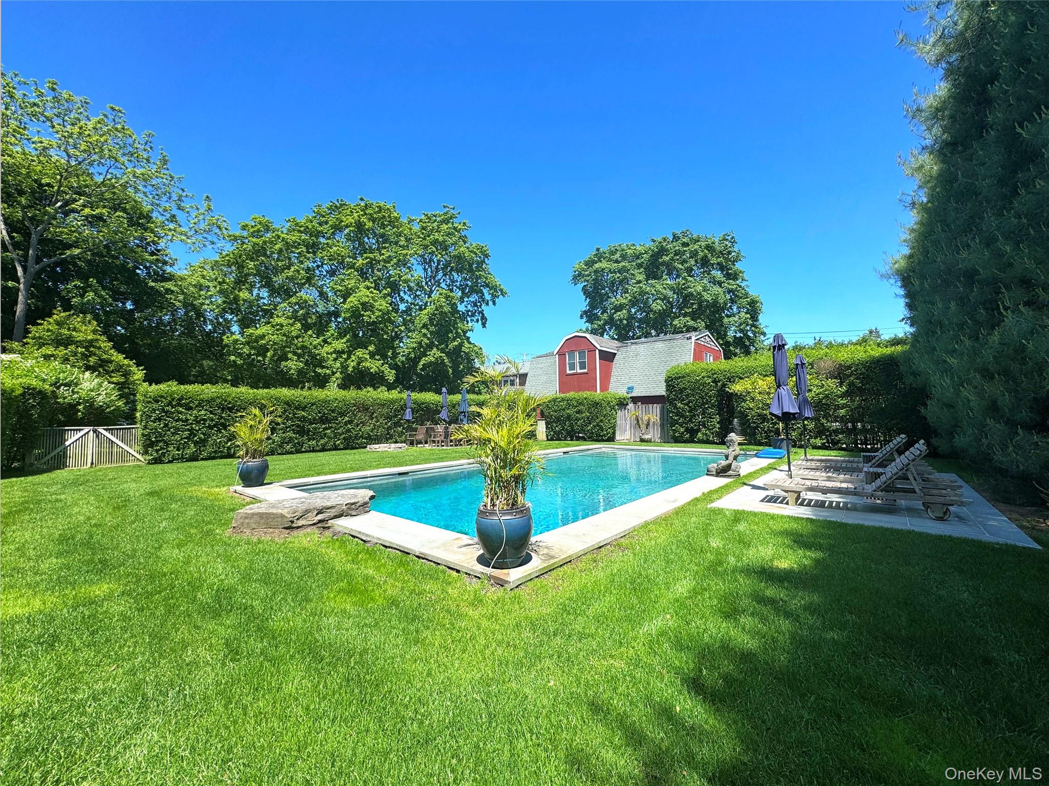 198 South Country Road Remsenburg, NY 11960 - Photo 46 of 49 a view of a garden with swimming pool