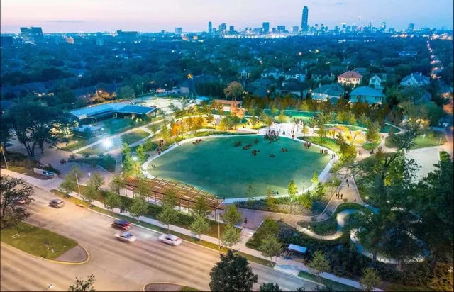 a view of a backyard with table and chairs potted plants