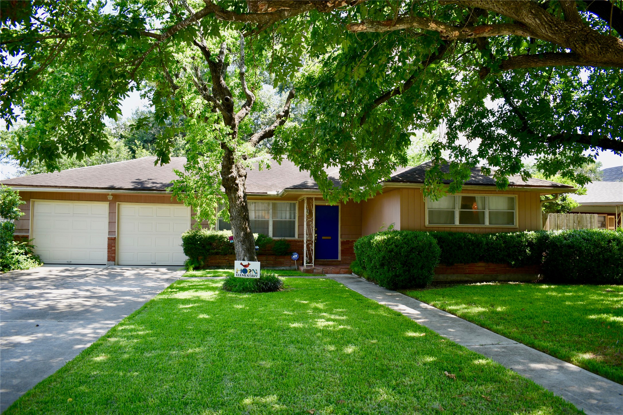 4624 Verone Street Bellaire, TX 77401 - Photo 6 of 33 a front view of a house with a yard and tree