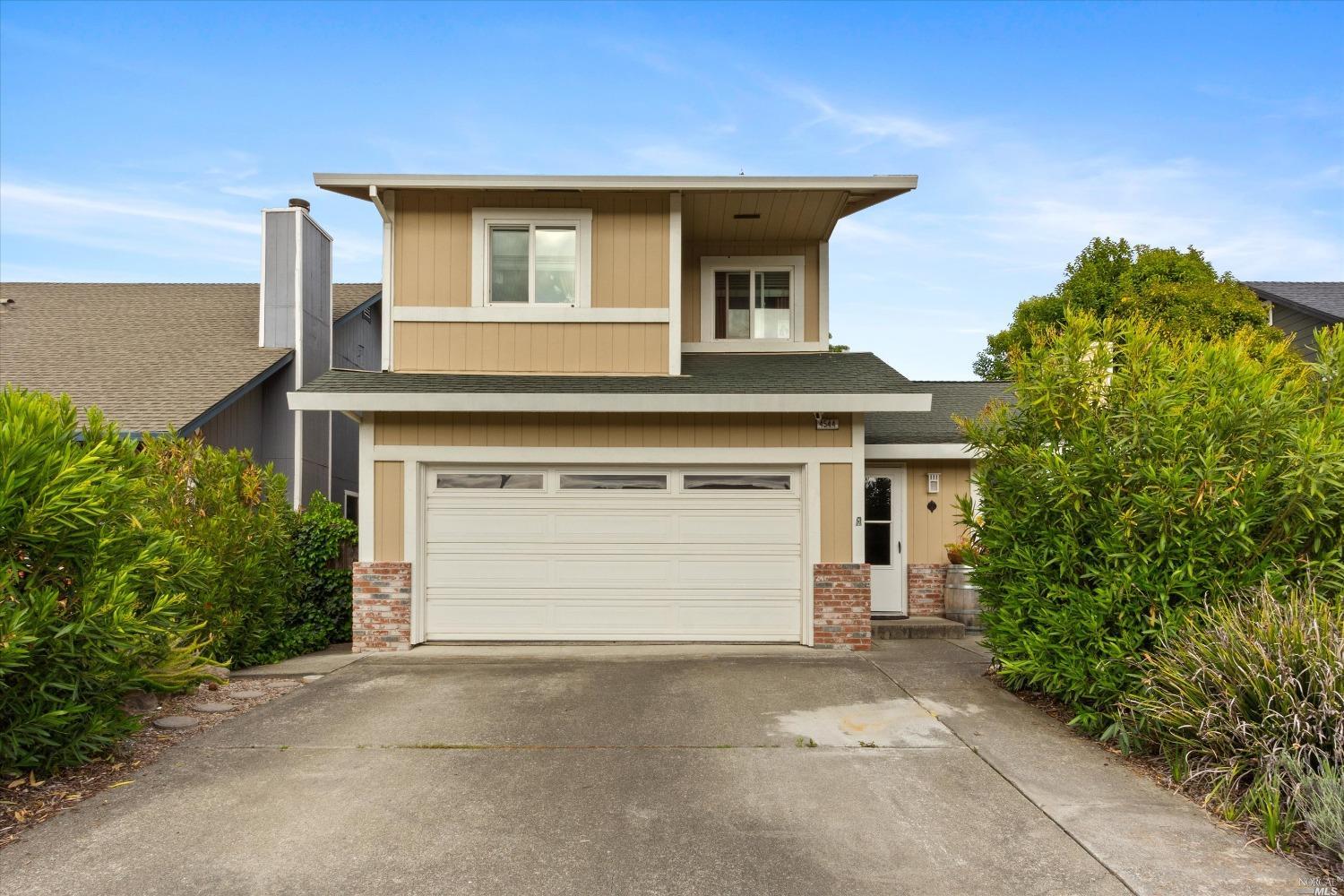 4544 Harmony Place Rohnert Park, CA 94928 - Photo 1 of 1 a front view of a house with a yard and garage