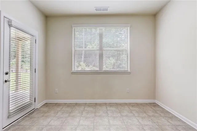 a kitchen with stainless steel appliances granite countertop a sink a stove and a microwave