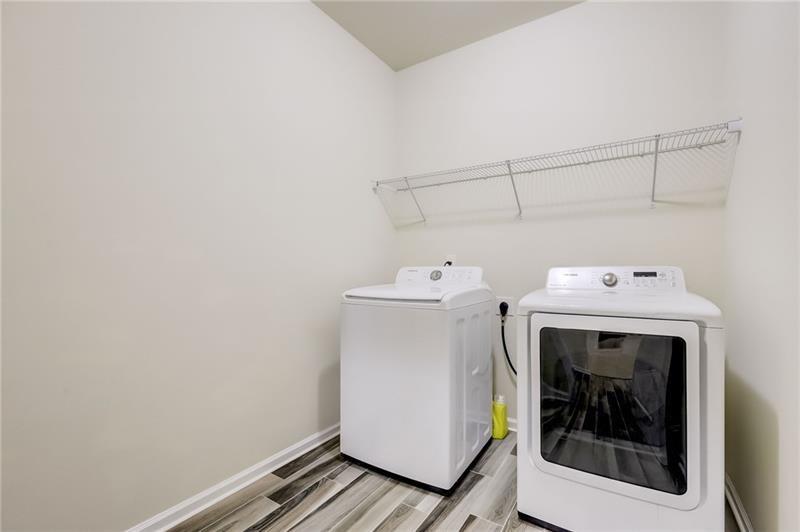 2680 Ogden Trail Buford, GA 30519 - Photo 16 of 45 a utility room with dryer and washer