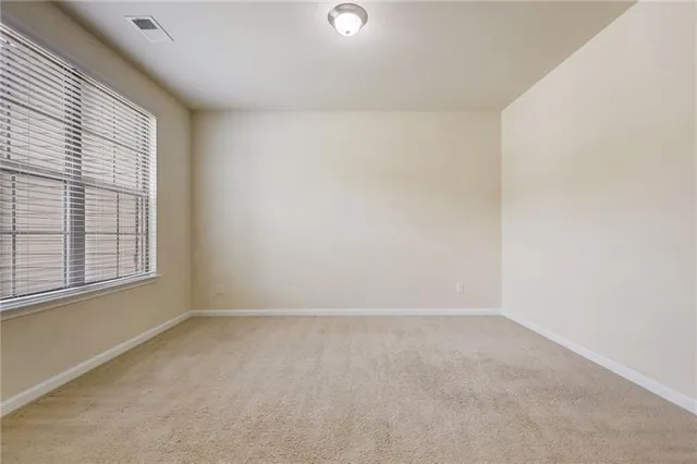 a view of an empty room and window