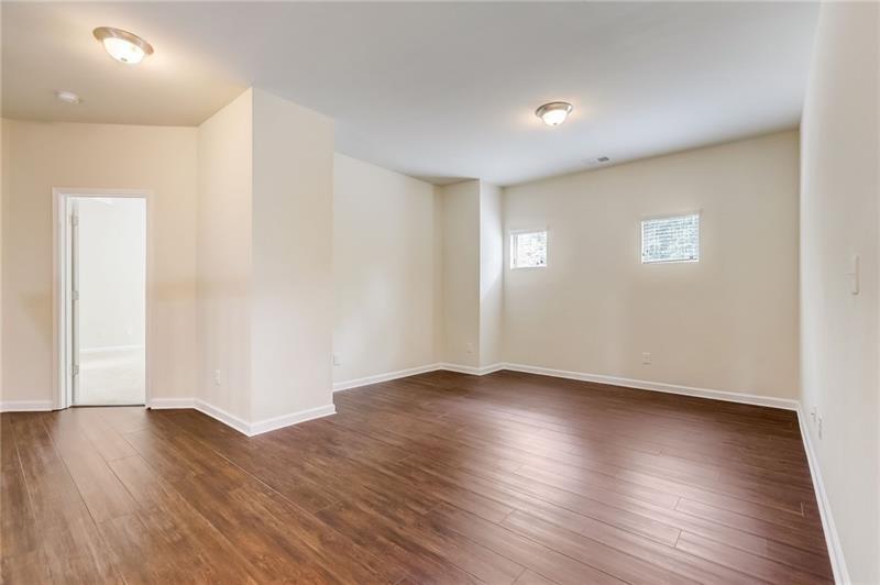 2680 Ogden Trail Buford, GA 30519 - Photo 23 of 45 a view of an empty room with wooden floor and a window