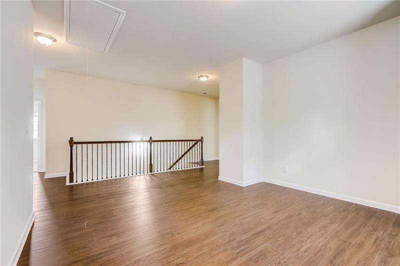 2680 Ogden Trail Buford, GA 30519 - Photo 24 of 45 a view of an empty room with wooden floor