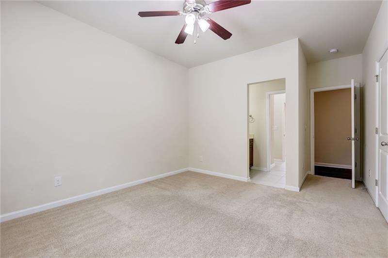 2680 Ogden Trail Buford, GA 30519 - Photo 30 of 45 an empty room with chandelier fan