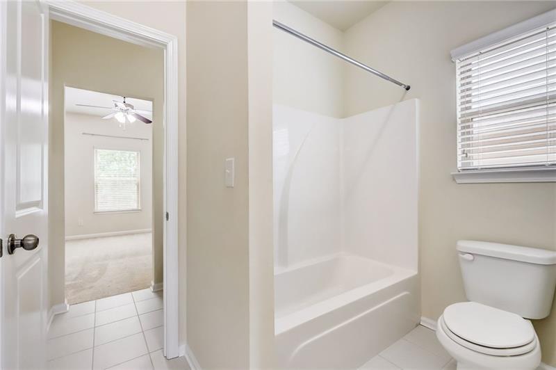 2680 Ogden Trail Buford, GA 30519 - Photo 33 of 45 a bathroom with a toilet and a shower