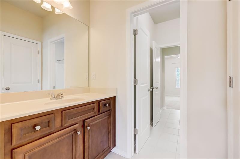 2680 Ogden Trail Buford, GA 30519 - Photo 34 of 45 a bathroom with a sink and a mirror