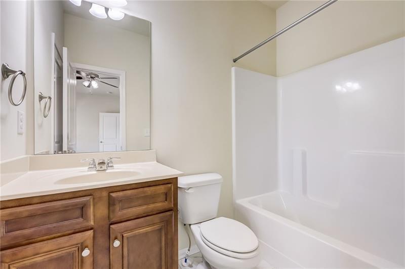 2680 Ogden Trail Buford, GA 30519 - Photo 41 of 45 a bathroom with a sink a toilet and shower