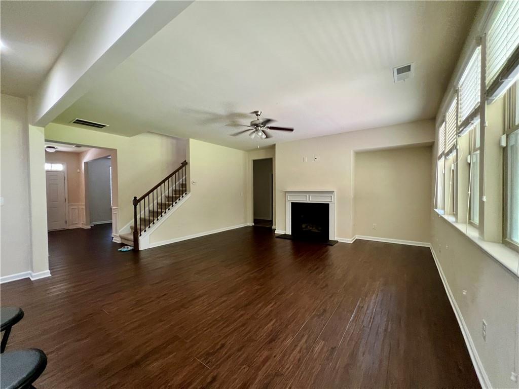2680 Ogden Trail Buford, GA 30519 - Photo 7 of 45 a view of entryway and hall with wooden floor
