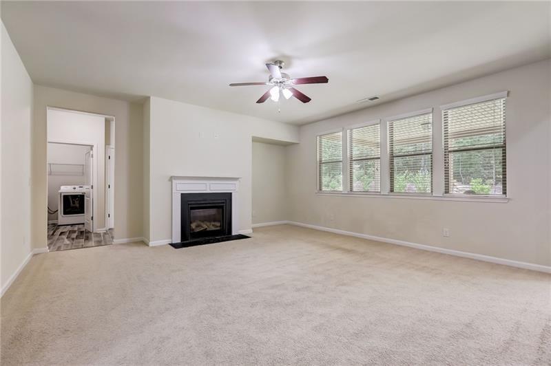 2680 Ogden Trail Buford, GA 30519 - Photo 10 of 45 a view of a livingroom with a fireplace and ceiling fan
