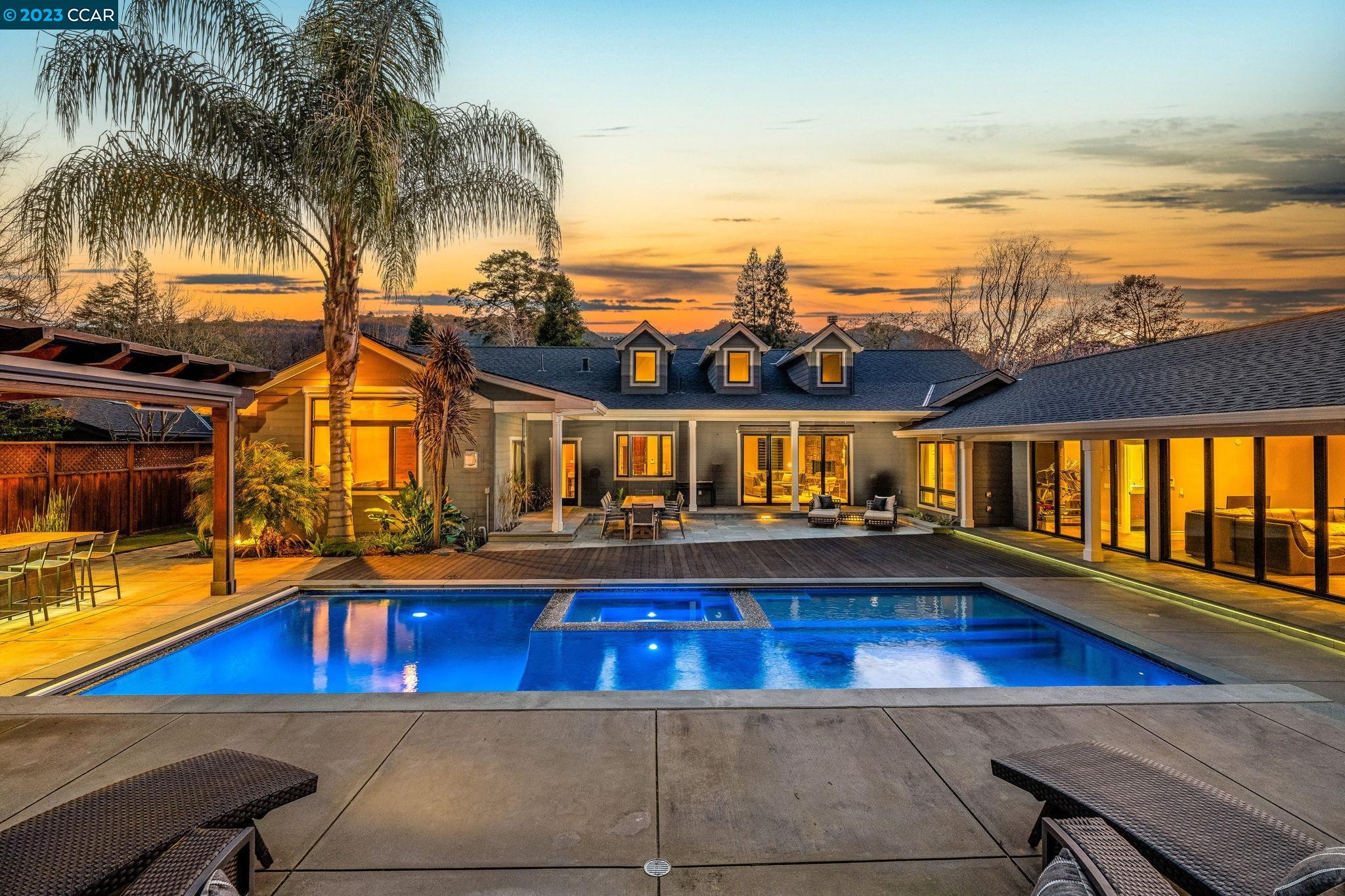 a view of a swimming pool with an outdoor seating