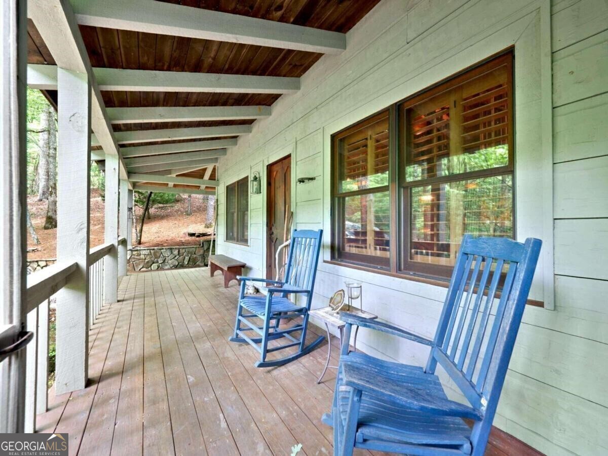 1402 Henderson Mountain Road Jasper, GA 30143 - Photo 11 of 76 a view of a dining room with furniture window and wooden floor