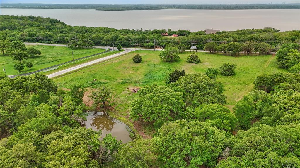 0 Turner Road Cross Roads, TX 76227 - Photo 5 of 18 a view of a lake with a yard