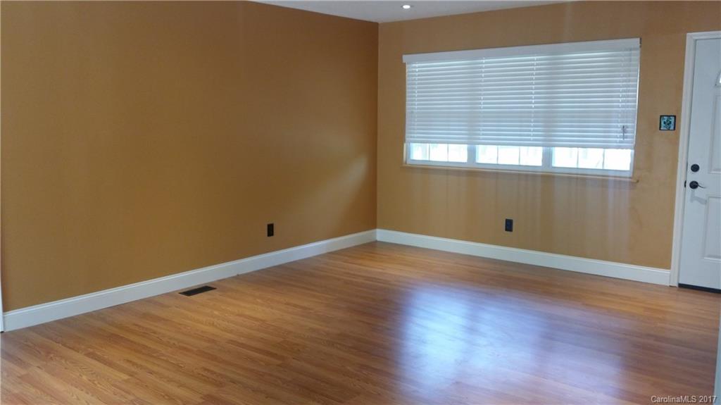 1929 State Rd S-29-584 Lancaster, SC 29720 - Photo 5 of 15 an empty room with wooden floor and windows