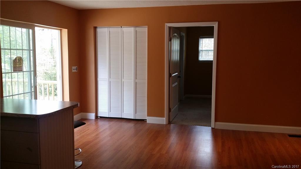 1929 State Rd S-29-584 Lancaster, SC 29720 - Photo 8 of 15 an empty room with wooden floor and windows