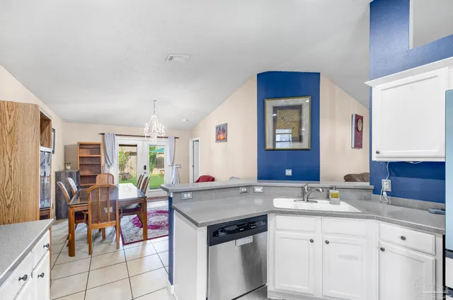 a view of living room with granite countertop furniture and floor to ceiling window
