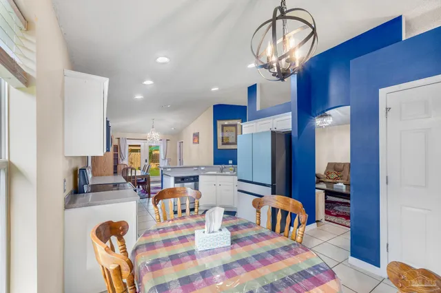 a bedroom with furniture a chandelier and a chandelier