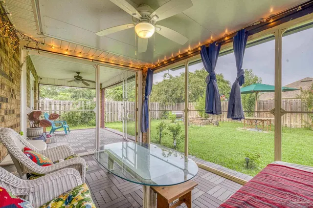 a living room filled with furniture and a garden