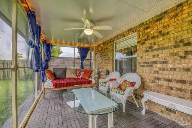 a view of a chairs and table in the balcony