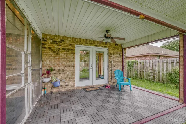 a view of a house with backyard and porch