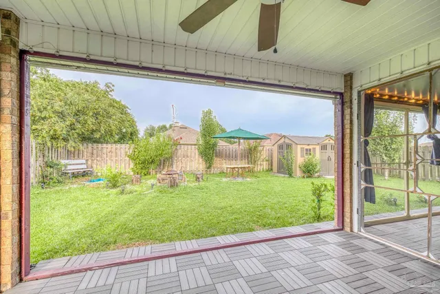 a view of a back yard from a room