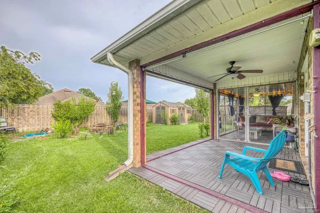 a backyard of a house with table and chairs