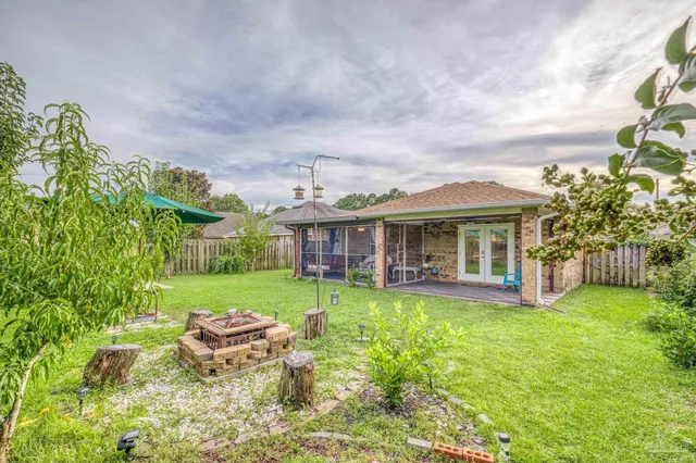 a view of a house with a yard porch and sitting area