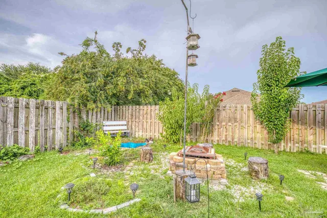 a garden view with a fountain