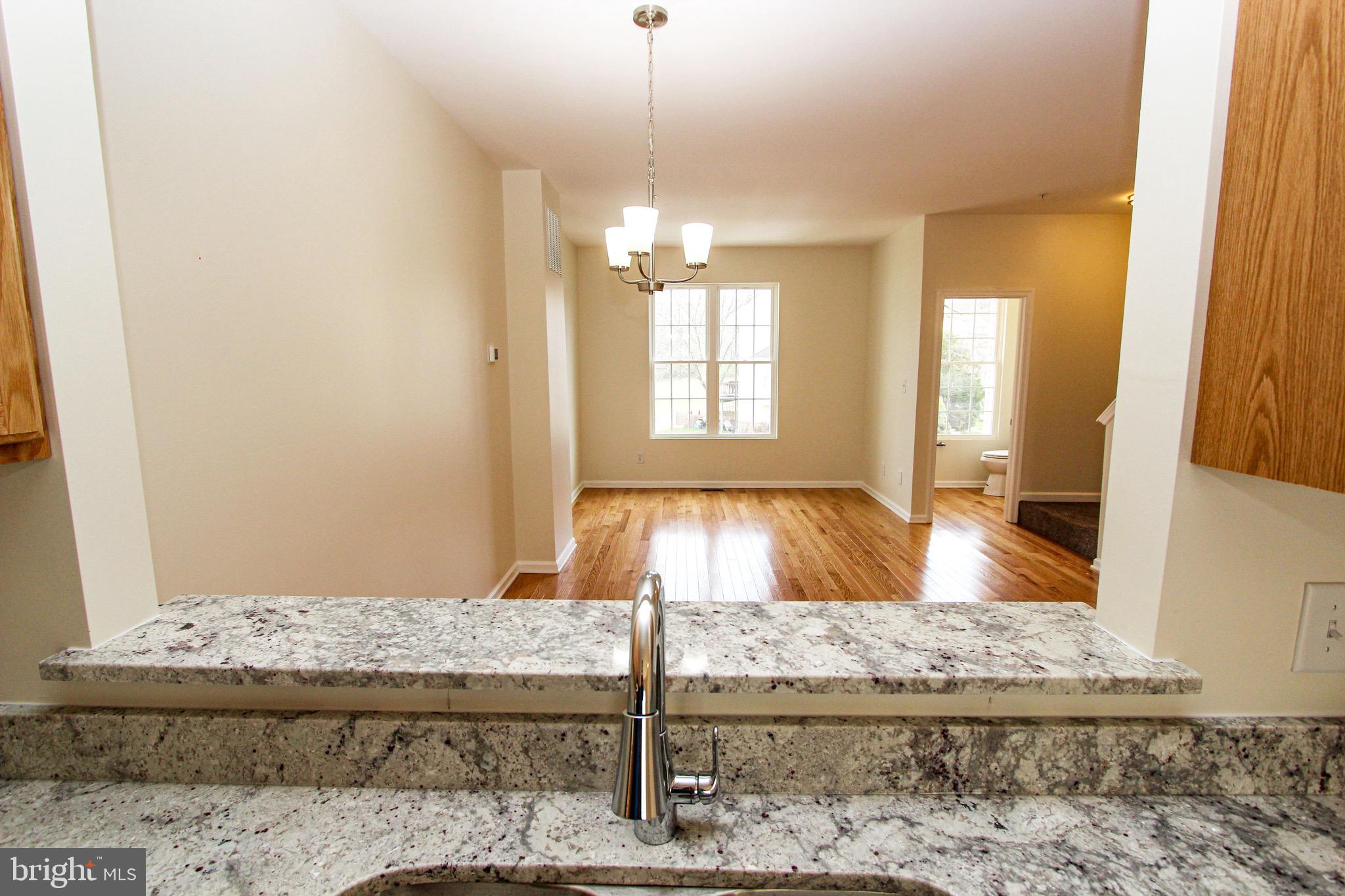 4 Whitetail Way Elkton, MD 21921 - Photo 13 of 28 a view of a livingroom with a fireplace and windows