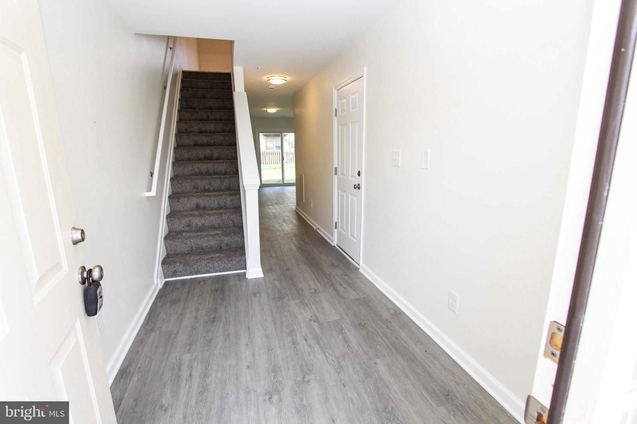4 Whitetail Way Elkton, MD 21921 - Photo 5 of 28 a view of a hallway with wooden floor and entryway