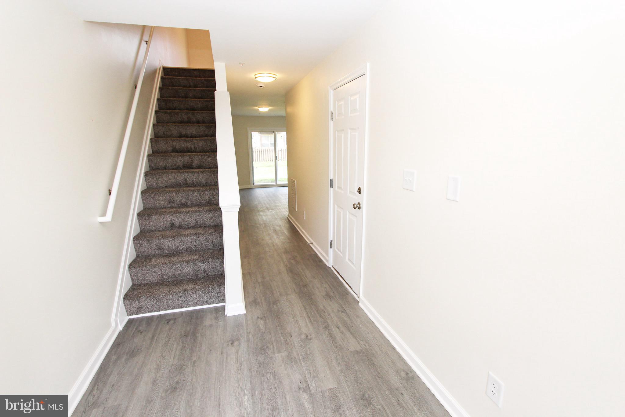 4 Whitetail Way Elkton, MD 21921 - Photo 7 of 28 a view of a hallway with wooden floor