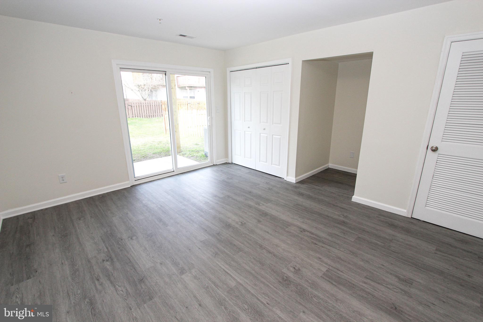 4 Whitetail Way Elkton, MD 21921 - Photo 8 of 28 an empty room with wooden floor and windows
