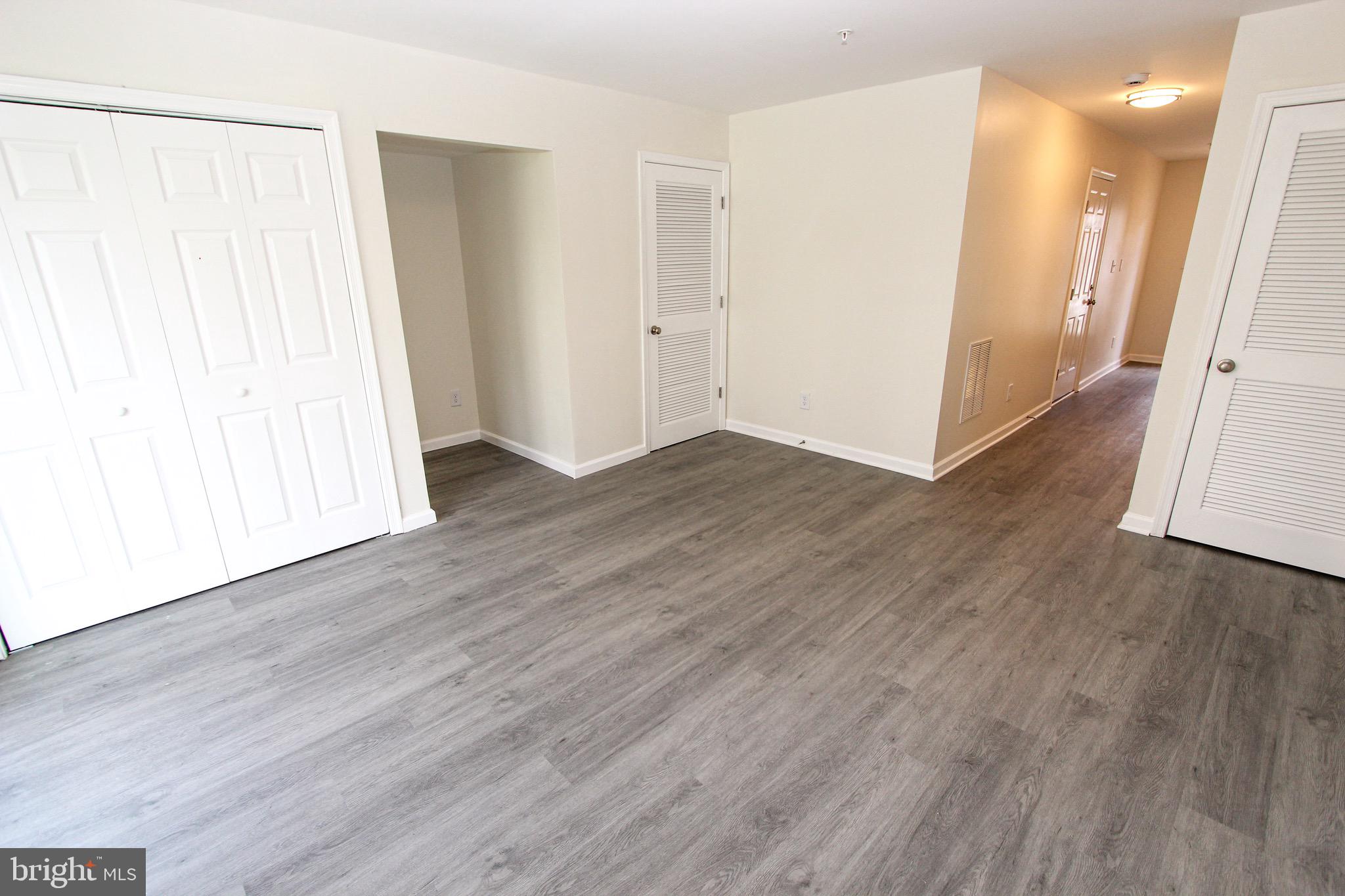 4 Whitetail Way Elkton, MD 21921 - Photo 9 of 28 an empty room with wooden floor and a window