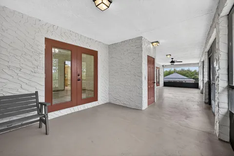an aerial view of a house with garden space and street view