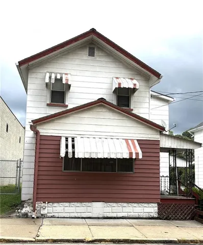 a front view of a house with garage