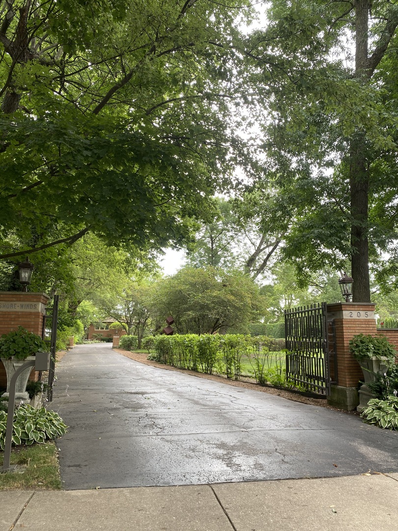 205 Sheridan Road Winnetka, IL 60093 - Photo 1 of 6 a view of a yard with plants and trees