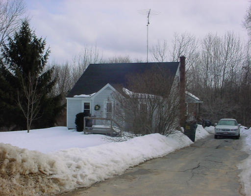 129 Stallion Hill Road Sturbridge, MA 01518 - Photo 1 of 1 a street view covered with snow