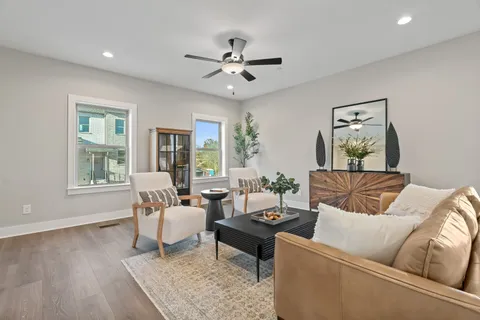 a living room with furniture and a large window
